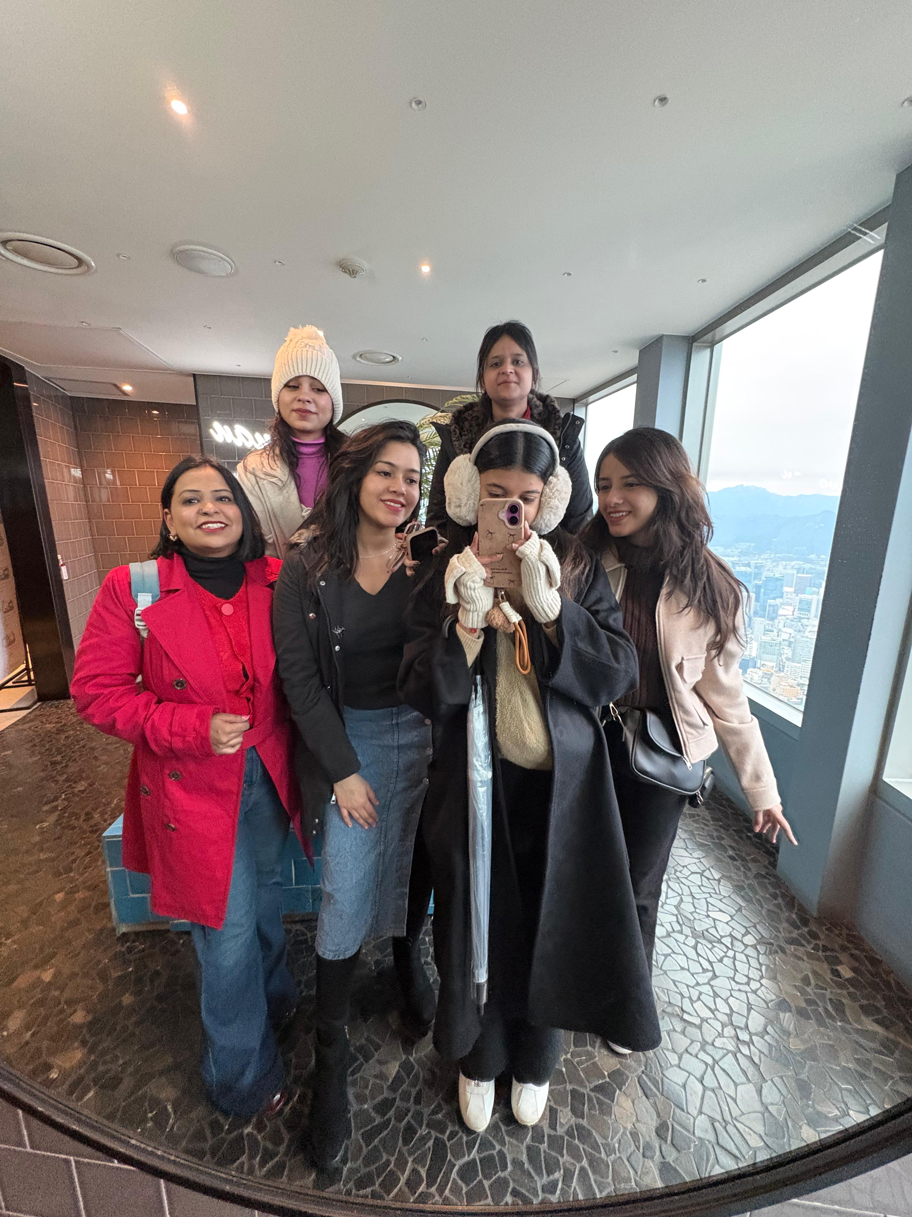 Travel group posing together indoors