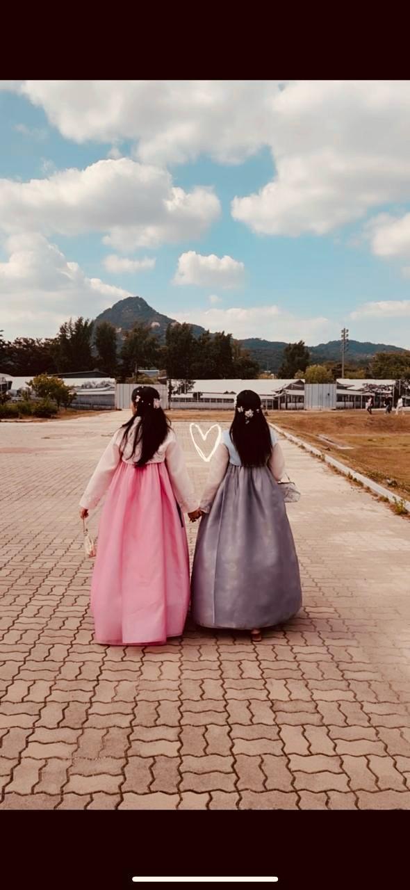 Friends strolling in traditional dresses