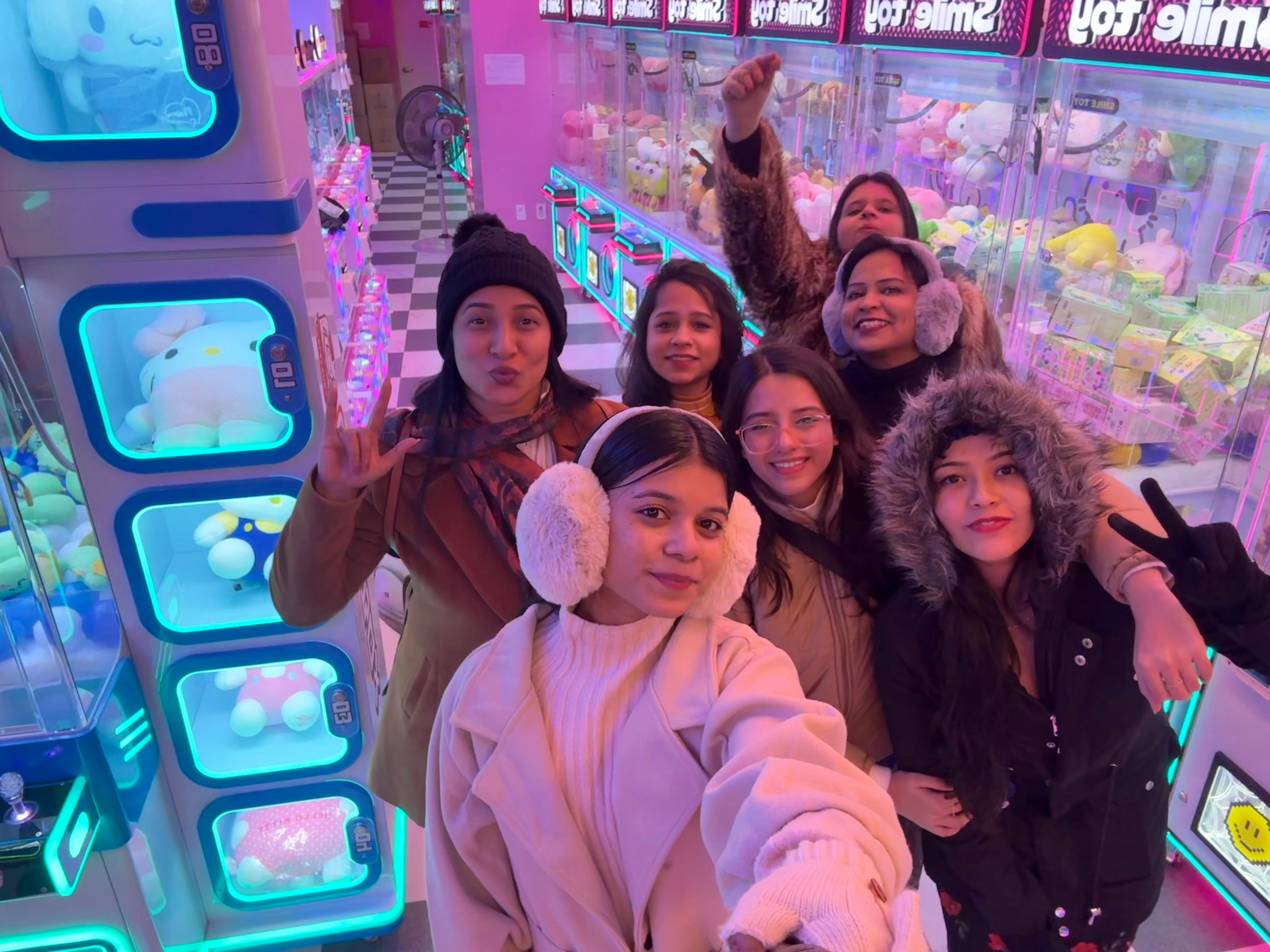 Friends enjoying a colorful arcade